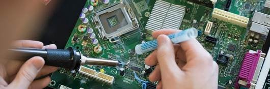 Person soldering a circuit board